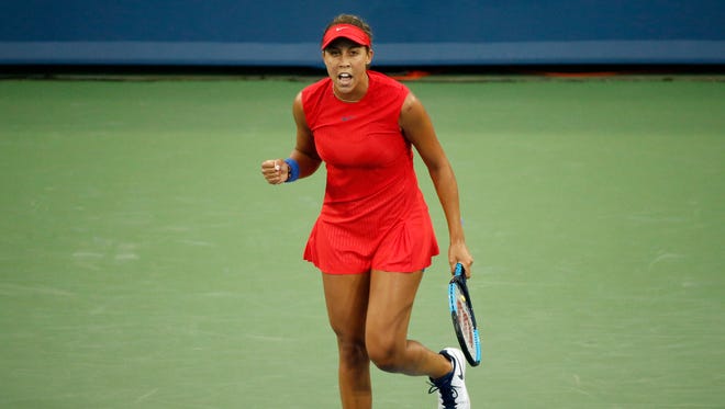 Madison Keys cheers after wining the first set of the match between CoCo Vandeweghe (USA) and Madison Keys (USA) during the Western & Southern Open at the Lindner Family Tennis Center in Mason, Ohio, on Monday, Aug. 14, 2017. Keys took the first set, 6-4.