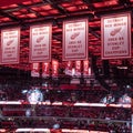 Who are the 8 Red Wings with numbers hanging from LCA rafters?