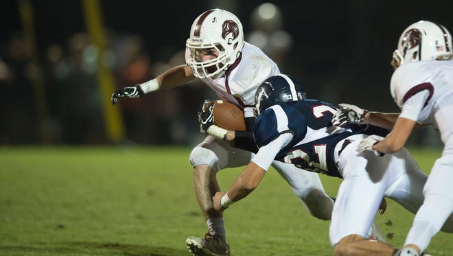 Montgomery Academy's Jack Mozingo (32) tackles Alabama Christian's Alden Stroud (3) during the football game Friday, Oct. 28, 2016, in Montgomery, Ala
