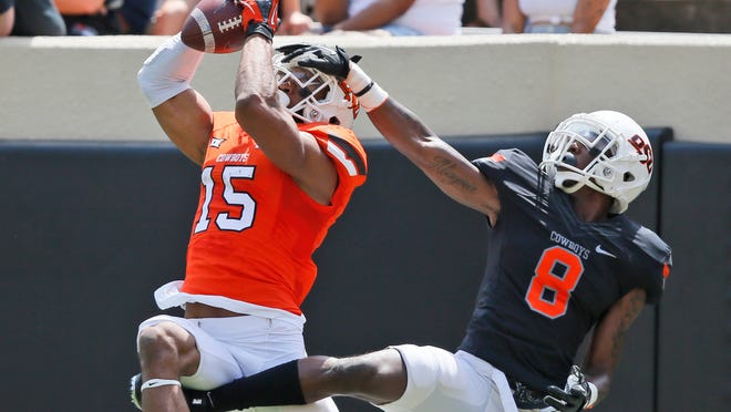 Oklahoma State receiver Chris Lacy catches a pass during the Cowboys' spring game in 2017.