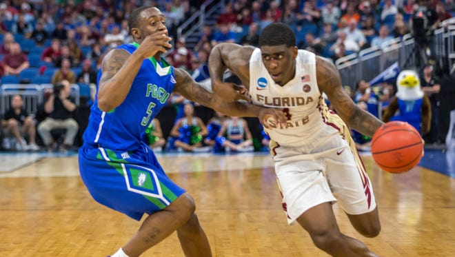 Florida State guard Dwayne Bacon drives to the hoop during his team’s 86-80 victory over Florida Gulf Coast in the first round of the NCAA Tournament on Thursday night at the Amway Center.