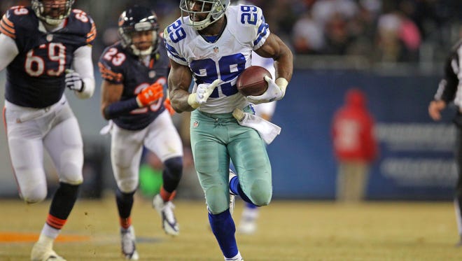 Dec 4, 2014; Chicago, IL, USA; Dallas Cowboys running back DeMarco Murray (29) runs with the ball during the second half against the Chicago Bears at Soldier Field. Dallas won 41-28.