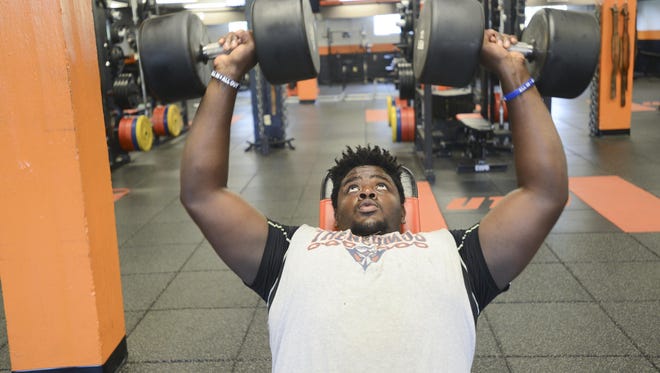 Damani Taylor, a football player at UTM, lifts weights during a workout Wednesday. Taylor attended Bethel University and transferred to UTM last year when he earned a full scholarship. Taylor, who will turn 21 in August, said that UTM has been his dream school since he was a toddler and is currently studying criminal justice at UTM.