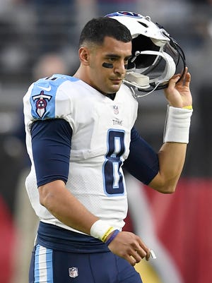 Titans quarterback Marcus Mariota (8) walks off the field after turning the ball over to the Cardinals on downs near the end of the 12-7 loss at University of Phoenix Stadium Sunday, Dec. 10, 2017 in Glendale, Ariz.