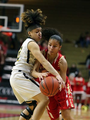 Piscataway's Tori Fisher (12) tries to get the ball away from Edison's Samira Sargent during the GMC Tournament final on Thursday, Feb. 22, 2018.