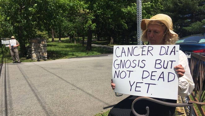 This woman, who refused to give her name, was among a handful of other protesters outside the Ethical Society of Northern Westchester in Ossining on Sunday, June 12, 2016. The protesters held signs opposing physician-assisted suicide, which was the topic of a documentary that was being shown inside the Ethical Society.