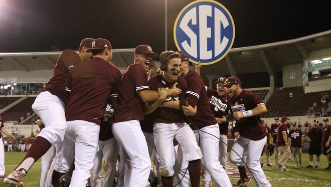 Mississippi State celebrates its first SEC championship since 1989 after a 9-4 win against Arkansas on Saturday.