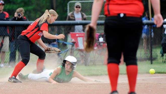 Huntington's Brookelyn Neighbors slides safely into third during a Division III district semifinal game against Alexander at Unioto High School on Wednesday. The final score was Alexander 1, Huntington 0.