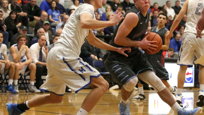 South Salem's Connor Fohn, right, drives past McNary's Cade Goff.