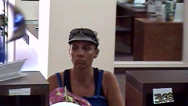 The Mesa Police Department are looking for a woman they believe to have called in a false bank robbery before she robbed another bank near by.