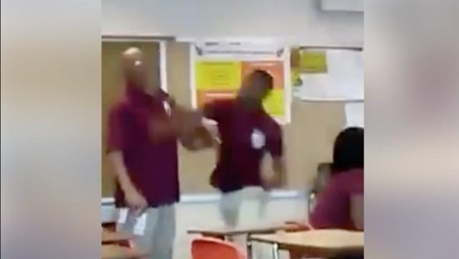Video of blue-haired student attacking teacher goes viral - wide 5