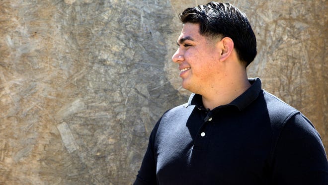 Felix Moran, 25,  walks through his old Phoenix neighborhood where he was a disconnected youth. When he was 17 he was sent to prison for burglary and when he was released he struggled to find employment. He is now joining Opportunities for Youth to do outreach to young people facing challenges like he did.