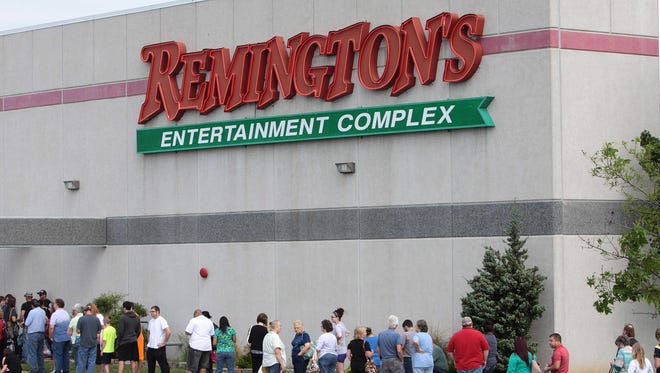 A 2014 photo shows people in line at Remington's waiting to be inoculated against the Hepatitis A virus.