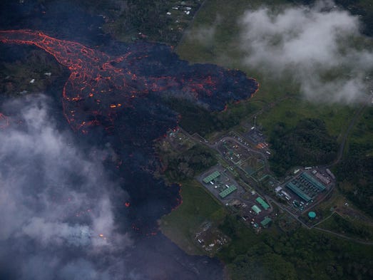A flow of lava moves to the doorsteps of the Puna Geothermal