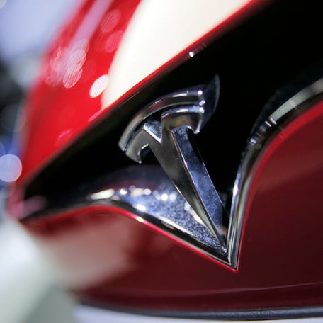 The logo of the Tesla Model S on display at the Paris Auto Show in Paris.