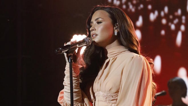 Tickets go on sale Friday for a performance by singer and actress Demi Lovato at Little Caesars Arena on March 13.