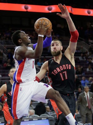 Detroit Pistons' Reggie Jackson goes to the basket against Toronto Raptors' Jonas Valanciunas during the second half on Tuesday, March 24, 2015, in Auburn Hills. Jackson scored 28 points in the Pistons 108-104 win.