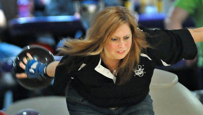 First-place finisher Shannon Orcutt rolls in the final round of Time-Nahan Women's Bowling Tournament at the Great River Bowl in Sartell Wednesday April 30.