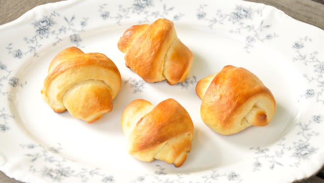 Bake crescent rolls at 400 degrees for 10 minutes or until golden brown. Brush tops with butter when they come out of the oven.