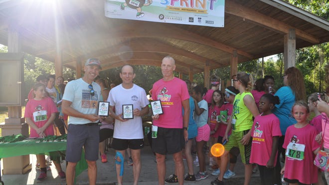 Top Overall Male Finishers  were, from left, Girl Scout dad David Sempier of Palm City, Gregg Fields of Palm Beach Gardens, and John Daddono, also of Palm Beach Gardens.