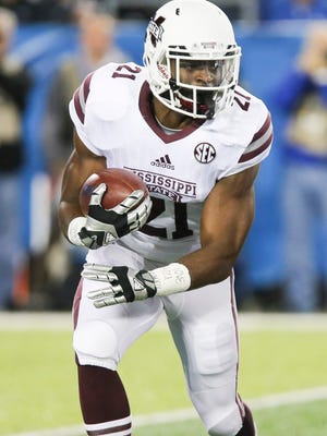 Mississippi State running back Nick Gibson runs the ball in the first half of an NCAA college football game against Kentucky Saturday in Lexington, Ky.