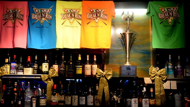 The Break-N-Run bar that has a 2013 APA National Championship trophy.