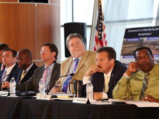 GE will locate at The Banks after Cincinnati City Council members and County Commissioners -- in a rare joint meeting -- approved incentives used to bring the 1,800 jobs to the Riverfront. From left to right are: Chris Monzel, John Cranley, Charlie Winburn, Greg Hartmann, Kevin Flynn, Todd Portune, and Wendell Young during the meeting at Great American Ball Park, Monday June 23, 2014.