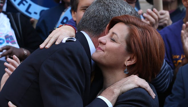 Christine Quinn, New York City Council Speaker and former mayoral hopeful, hugs Democratic Party nominee Bill de Blasio at a news conference where Quinn endorsed de Blasio on Sept. 17 in New York City.