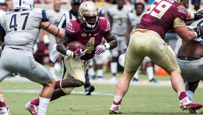 Florida State running back Dalvin Cook carries the ball against Charleston Southern in the first half at Doak Campbell Stadium.
