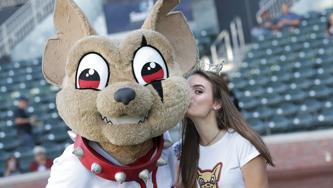 Miss El Paso Outstanding Teen Madelyn Assi plants one on Chico’s cheek before singing the national anthem before Thursday’s game against Las Vegas. See more photos at elpasotimes.com.