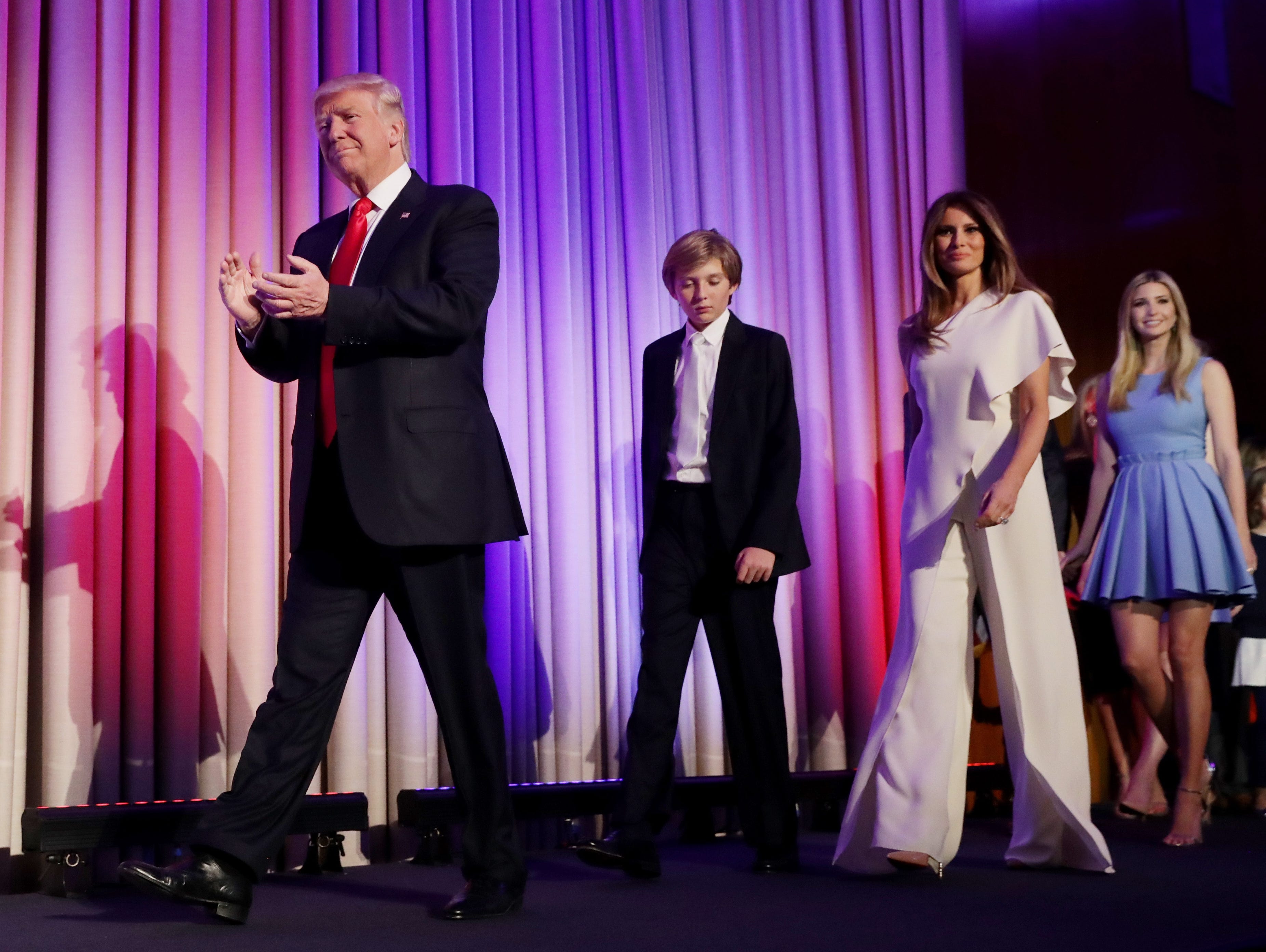Republican president-elect Donald Trump walks on stage with his son Barron, wife Melania and daughter Ivanka on Nov. 9, 2016, in New York City.