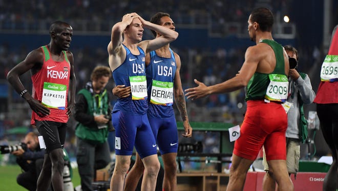 Aug 15, 2016; Rio de Janeiro, Brazil; Clayton Murphy (USA) reacts with Boris Berian (USA) after placing third during the men's 800m final in the Rio 2016 Summer Olympic Games at Estadio Olimpico Joao Havelange. Mandatory Credit: James Lang-USA TODAY Sports