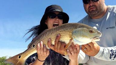 PIC OF THE WEEK: Aimee Roth proved Boston strong (and excited) when she bested her first redfish, a 26-incher, in Estero Bay with Get Hooked Charters Capt. Matt DeAngelis.