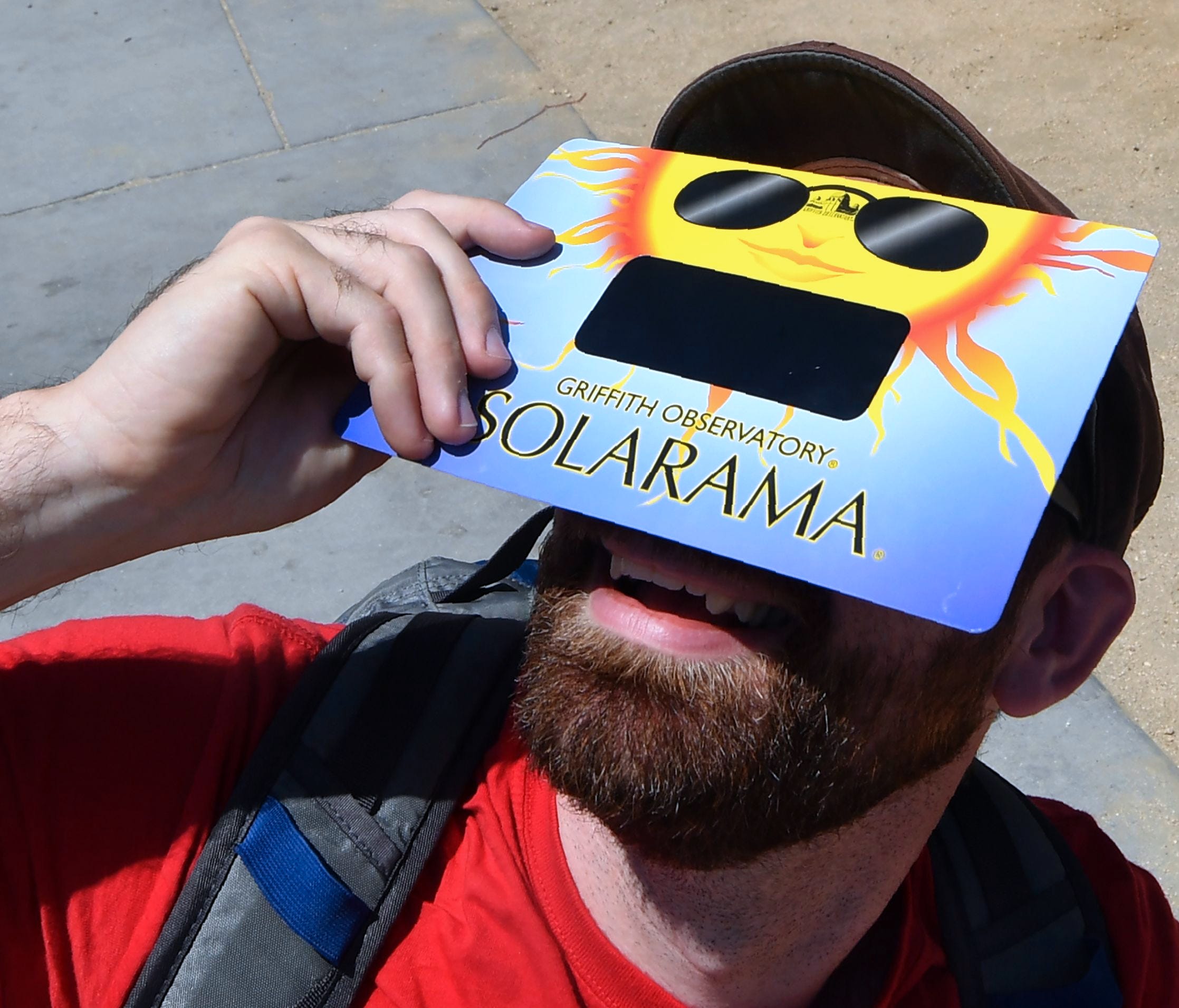 Daniel Rossman takes a look at the sun with solar eclipse glasses during the Solar Eclipse Festival at the California Science Center in Los Angeles, California, on Aug. 19, 2017, two days before The Solar Eclipse on Aug. 21.