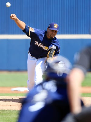 Milwaukee Brewers Hiram Burgos delivers a pitch in spring training.
