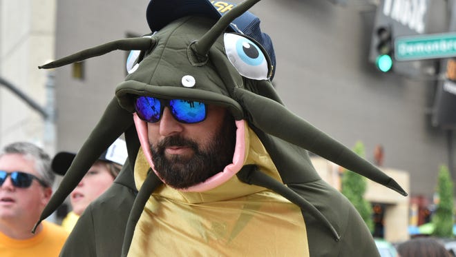 A fan wearing a catfish costume makes his way to the front of Bridgestone Arena. He was one of several fans wearing the same suit at Game 3.