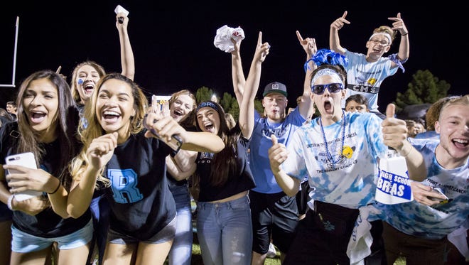 Cactus students celebrate their win against the Peoria Panthers at Cactus High School on Friday, September 29, 2017 in Glendale, Arizona.