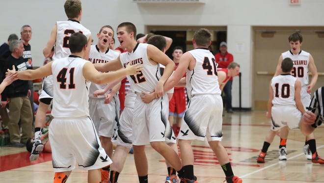 Jared Joslin, center, and the Port Edwards boys basketball team enter the week with a 16-0 record.