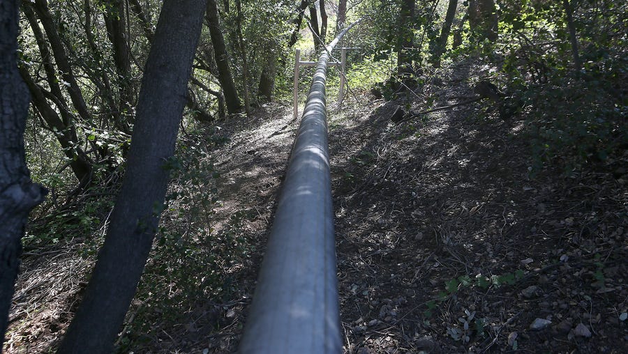 In a remote area of the San Bernardino forest, a pipe hisses with the sound of mountain spring water it carries to Nestle North America tanks where it is then transported to Ontario, Calif., for bottling.
