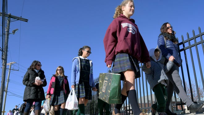 In this file photo, St. Patrick School students walk to Our Daily Bread while delivering items collected in the school's food drive in November 2015. The Diocese of Harrisburg announced the York City Catholic School will be merging with St. Joseph School-Dallastown at the end of the current school year.