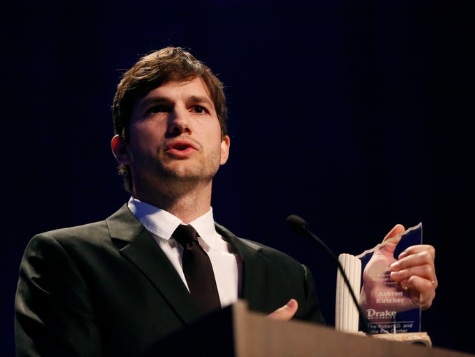 Actor and Iowa native Ashton Kutcher accepts the Robert