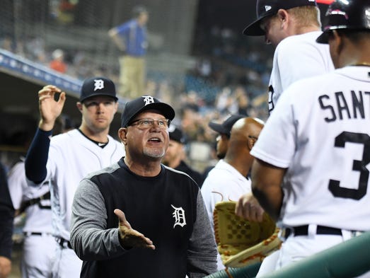 Tigers manager greets pitcher Daniel Stumpf after the