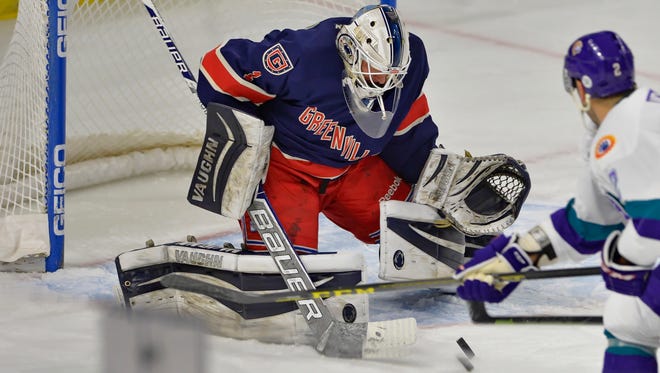 Greenville goalie PJ Musico blocks a shot by Orlando's Max Nicastro. The Greenville Swamp Rabbits hosted the Orlando Solar Bears in an ECHL hockey game Sunday, Dec. 20, 2015 at BSWA.