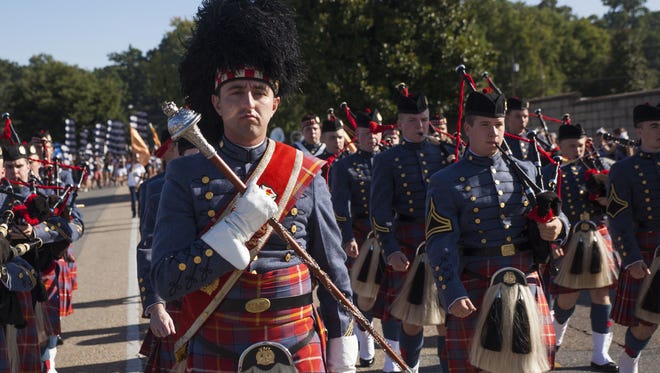 Jacob Pullias, a drum major with Virginia Military Institute's Pipe Band, leads the group along the parade route at the annual Buena Vista Labor Day Festival on Sept. 1, 2014.