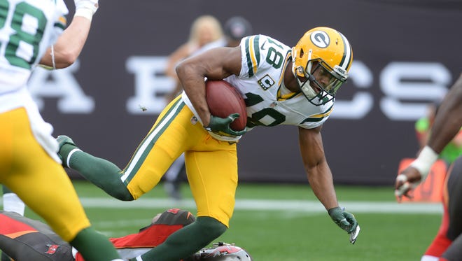Green Bay Packers receiver Randall Cobb (18) runs after catching a pass against the Tampa Bay Buccaneers at Raymond James Stadium.