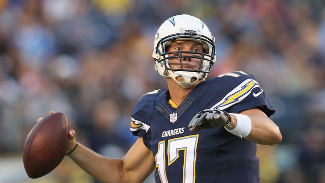 Philip Rivers of the San Diego Chargers looks to pass against the Dallas Cowboys on Aug. 7, 2014, in San Diego.