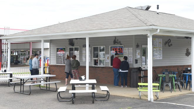 Customers place their orders at the new Thatsa Wrapp location in North Canton in this file photo.