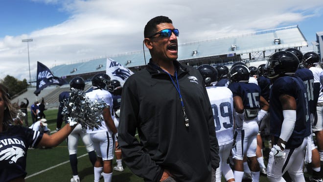 Nevada head coach Jay Norvell brings his players on the field for the annual Spring Game at Mackay Stadium in Reno on April 28, 2018.