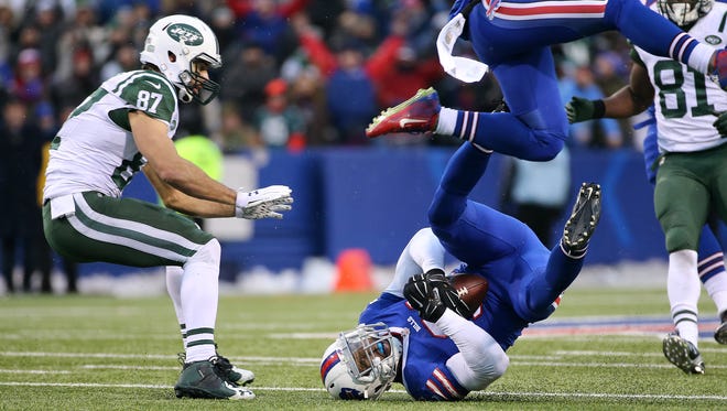 Buffalo's Mann Lawson  intercepts a pass  near the end of the game  intended for Jets Eric Decker.  The Bills beat the Jets 22-17 to knock them out of the playoff picture. 