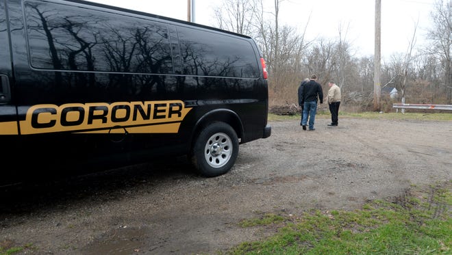 RIchmond police detectives and the Wayne County Coroner investigate after a body was found Wednesday, Dec. 2, 2015, at N. 17th Street in Richmond.
